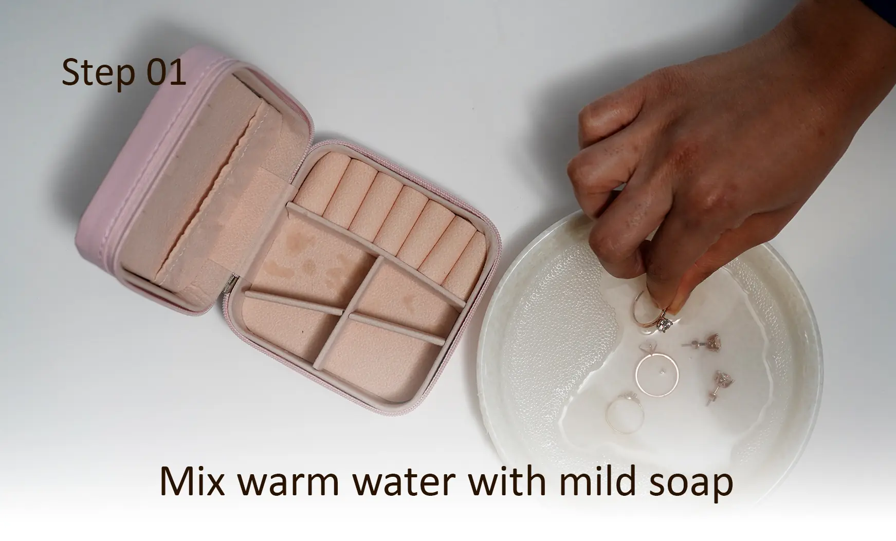 Step 1: Mix warm water with mild soap
